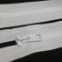 Zips vetrovkový, kosticový - UH - 55 cm - Biela 01